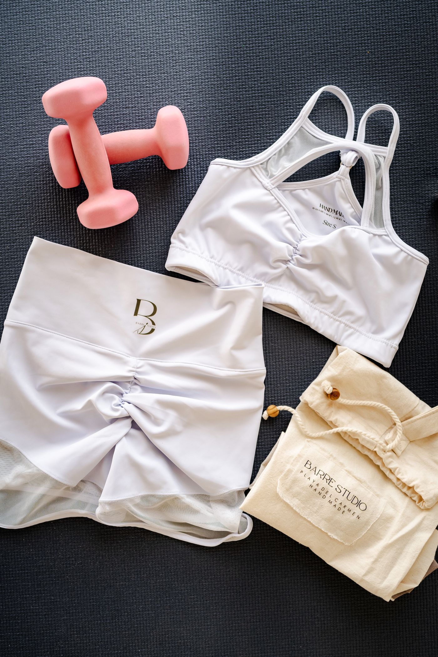 Flat lay of sports bra, shorts, leggings and workout gear