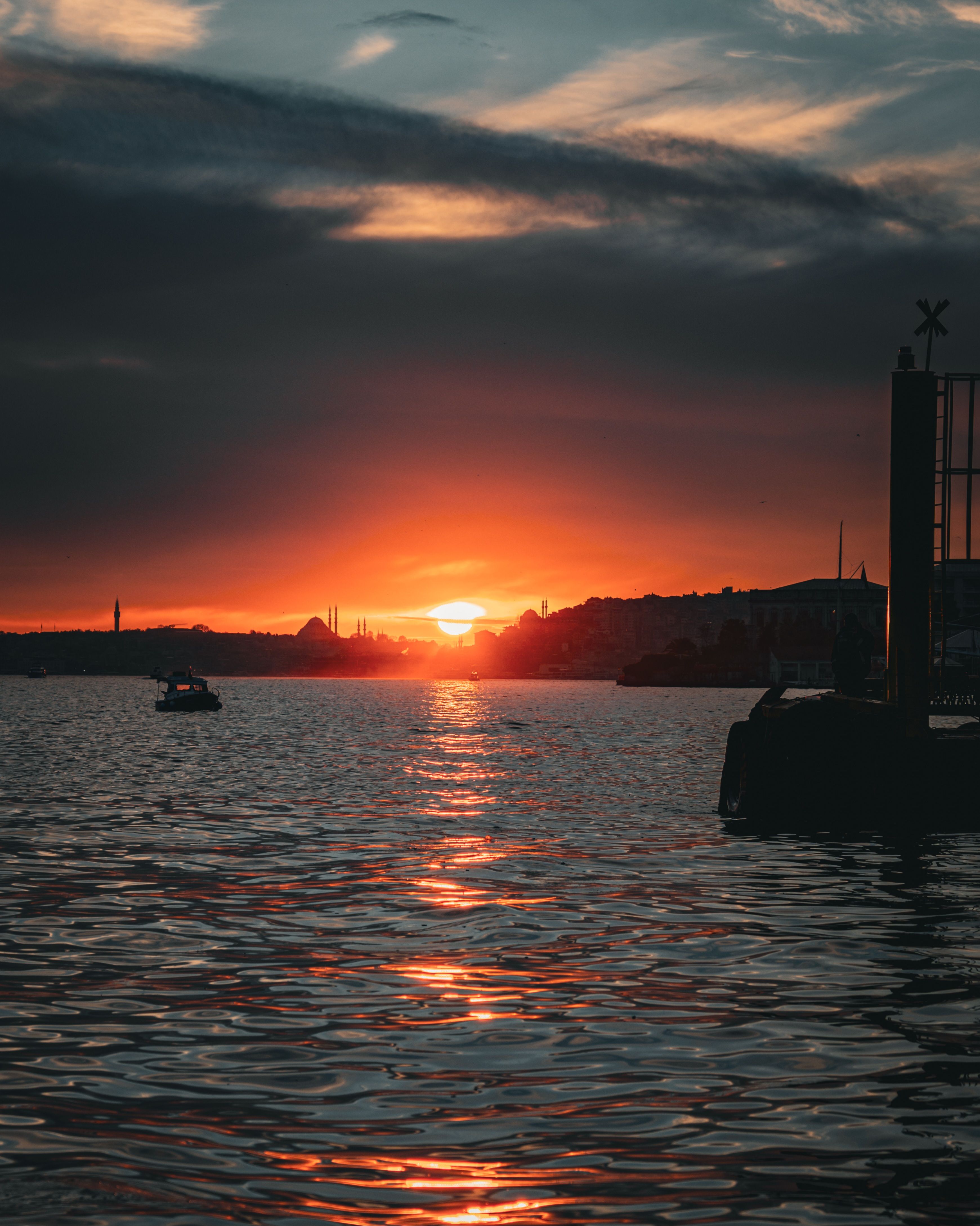Scenic Waterfront Sunset with Silhouettes · Free Stock Photo