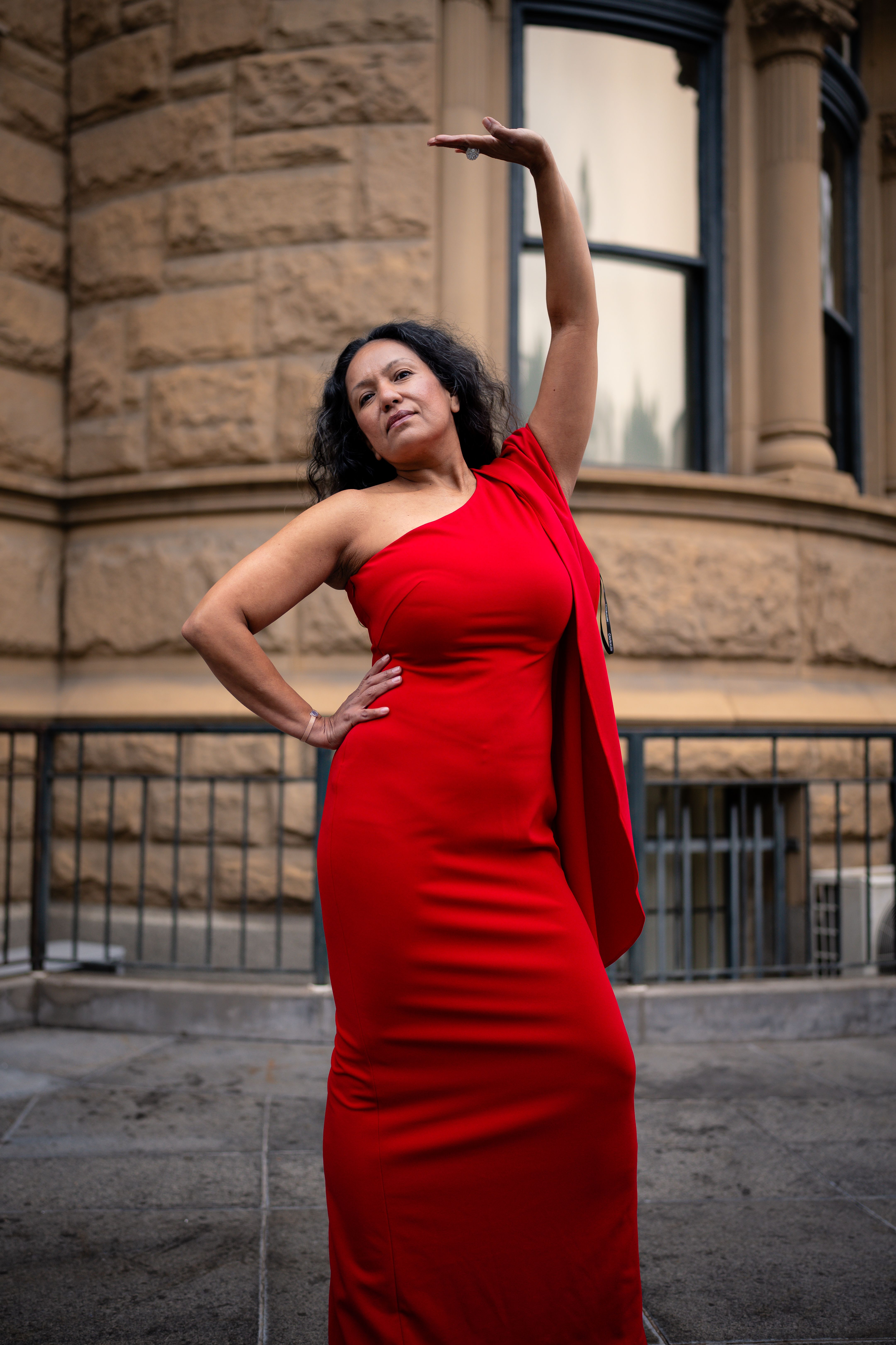 Elegant Woman in Red Dress Posing Outdoors · Free Stock Photo