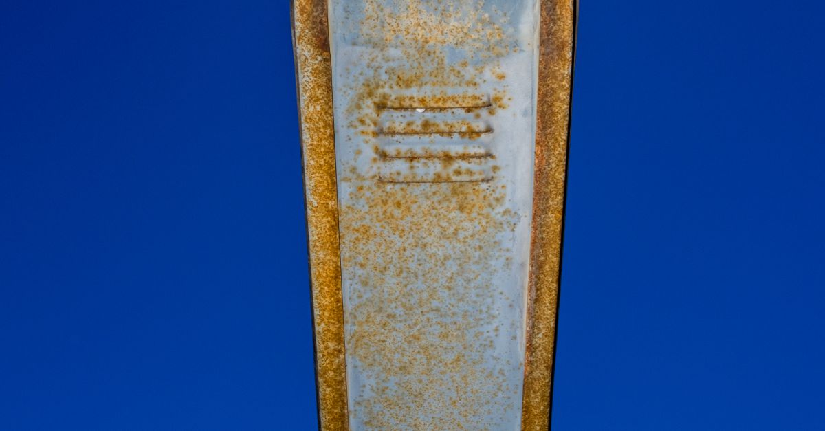 Rusty Metal Object Against Blue Sky · Free Stock Photo