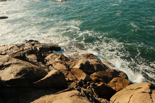 Free Rugged rocks and waves along the coastal landscape of Porto, Portugal. Stock Photo