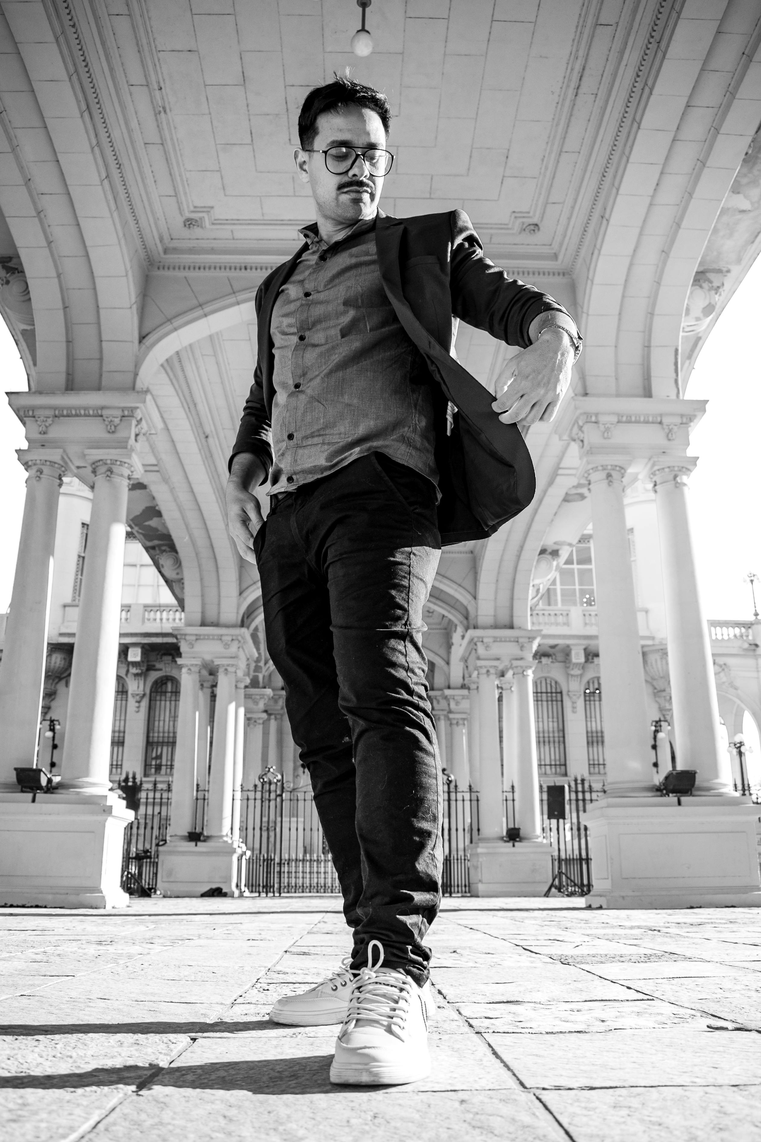 Black and white portrait of a young man outdoors in Buenos Aires, Argentina.