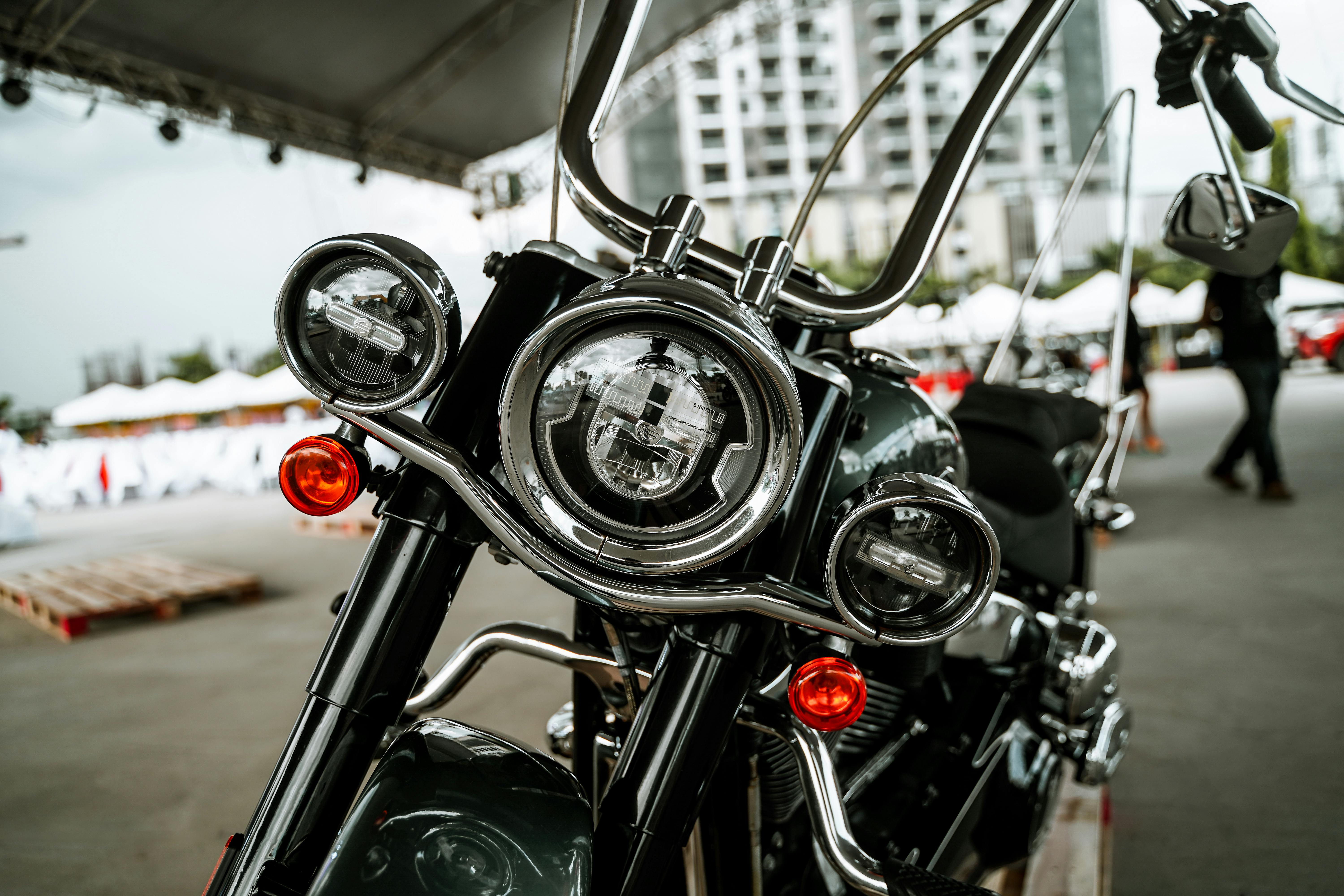 Free Detailed close-up of a motorcycle's headlights at an outdoor event in Quezon City, Philippines. Stock Photo