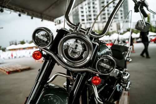 Free Detailed close-up of a motorcycle's headlights at an outdoor event in Quezon City, Philippines. Stock Photo