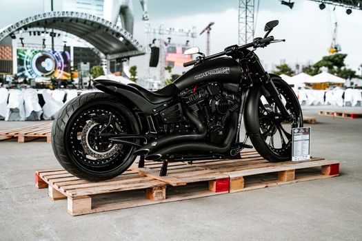 A stylish Harley-Davidson motorcycle displayed outdoors in Quezon City, Philippines.