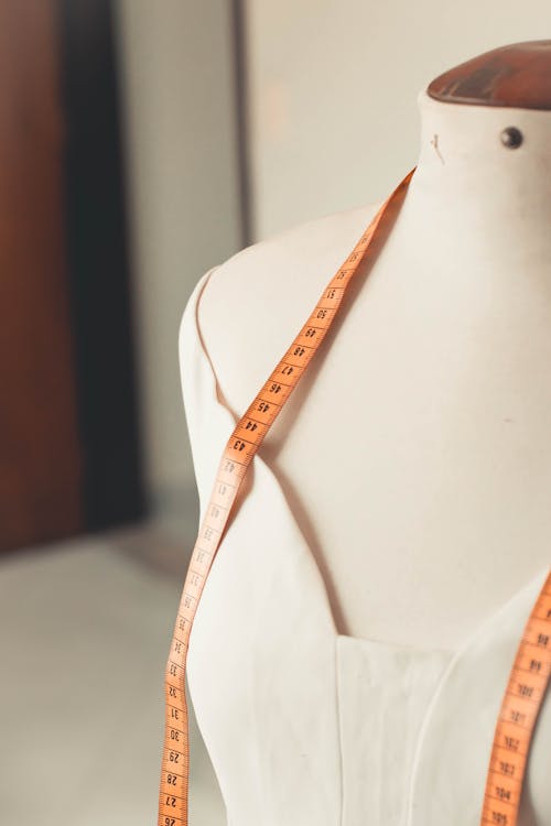 Free Measuring Tape on a Dress Form Stock Photo
