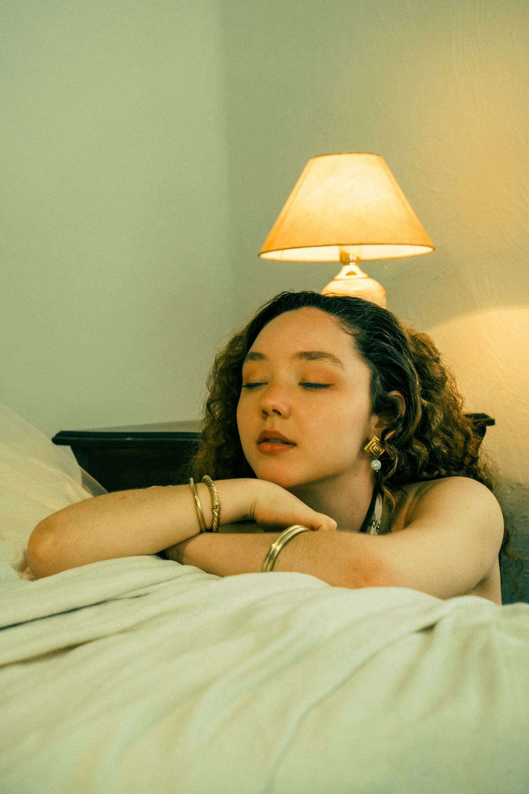 A peaceful woman resting at home in warm light