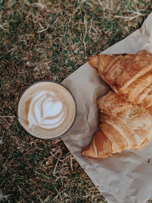 Free Cappuccino by Croissant on Ground Stock Photo
