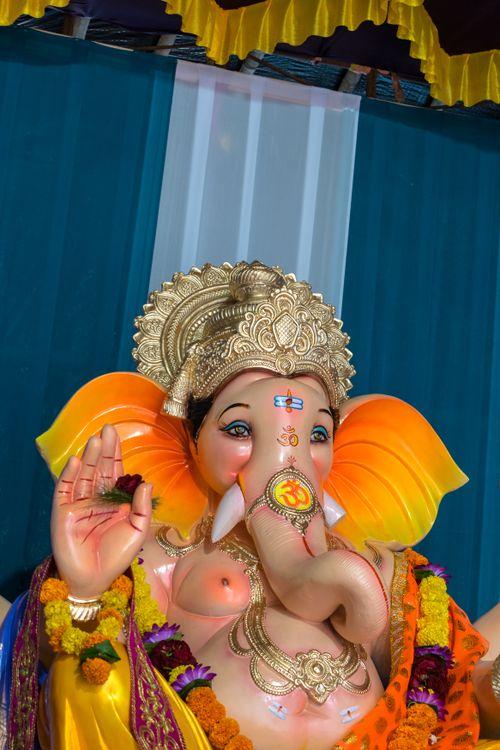 Free Colorful Ganesh idol adorned with flowers at a festival in Mumbai, India. Stock Photo