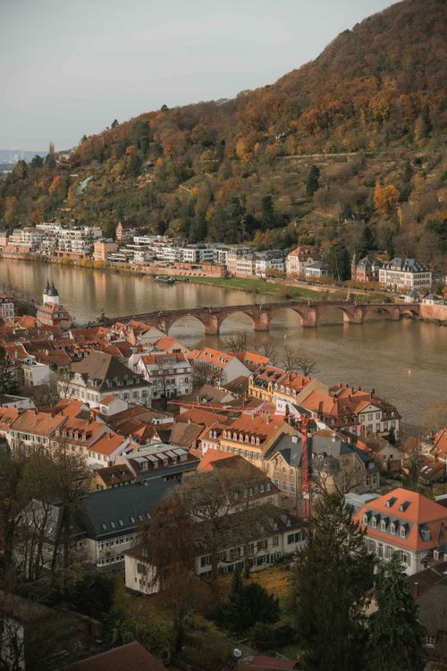Free A scenic aerial view of Heidelberg's Altstadt with its iconic arch bridge and Neckar River. Stock Photo