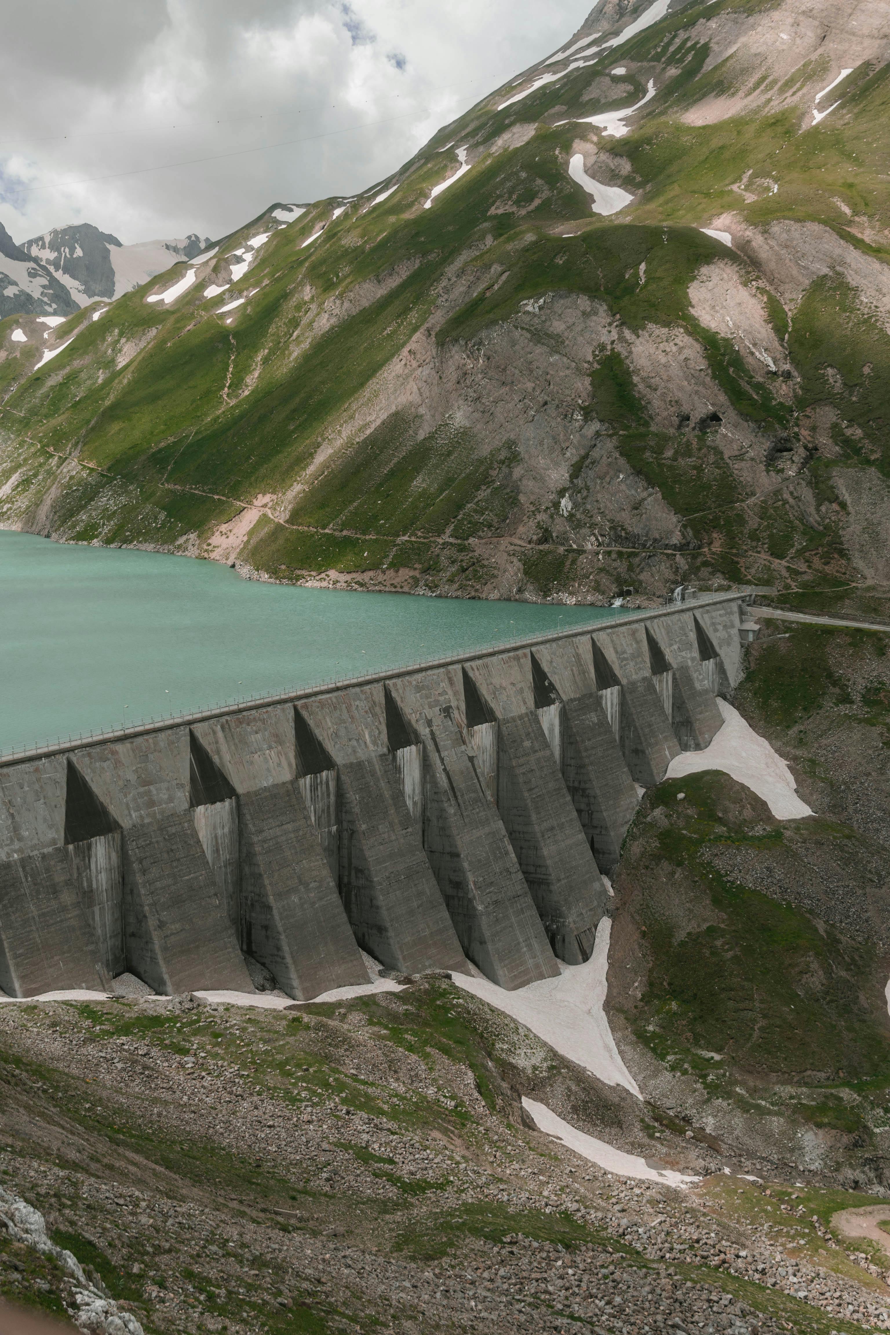 A scenic view showcasing the impressive dam nestled in Piemonte's mountainous terrain.