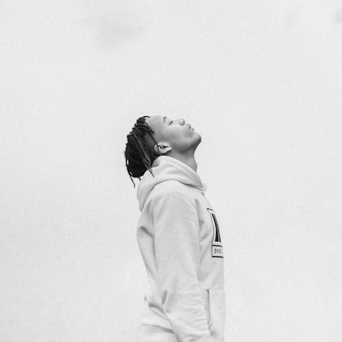 Grayscale Photo of Man Wearing Hoodie Jacket