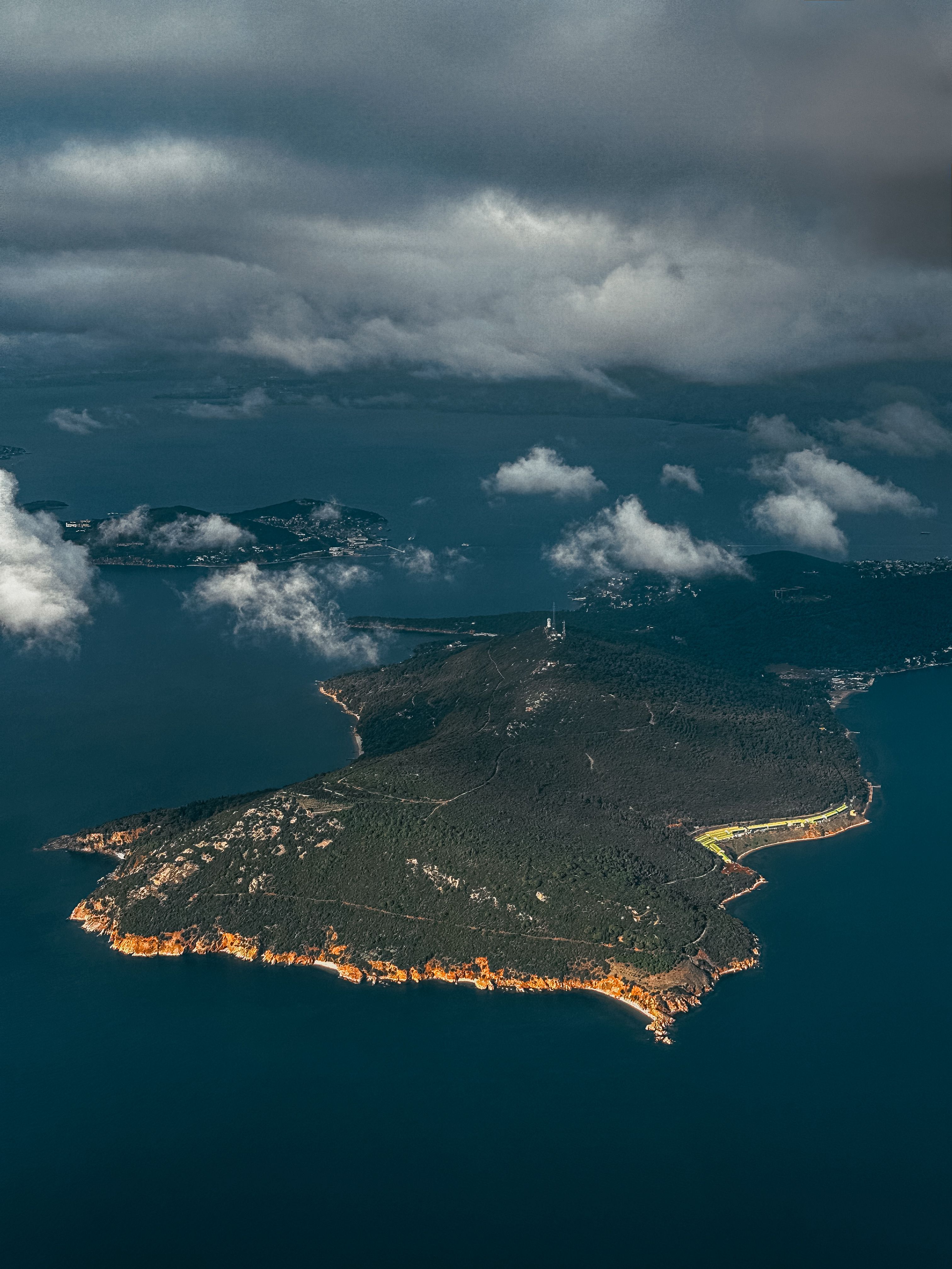 Aerial View of Rocky Island with Lush Greenery · Free Stock Photo