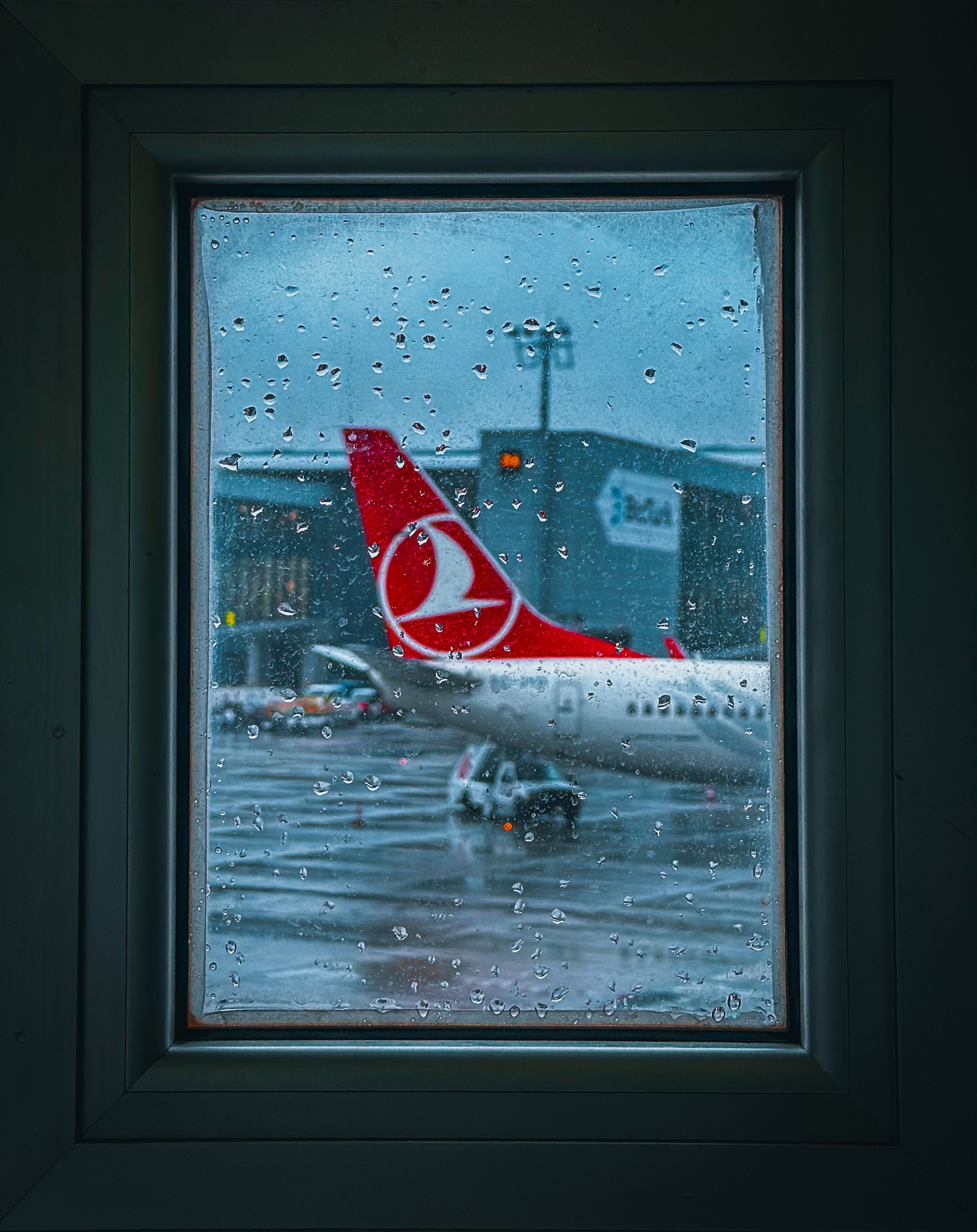 Airplane View Through Rainy Window at Airport · Free Stock Photo