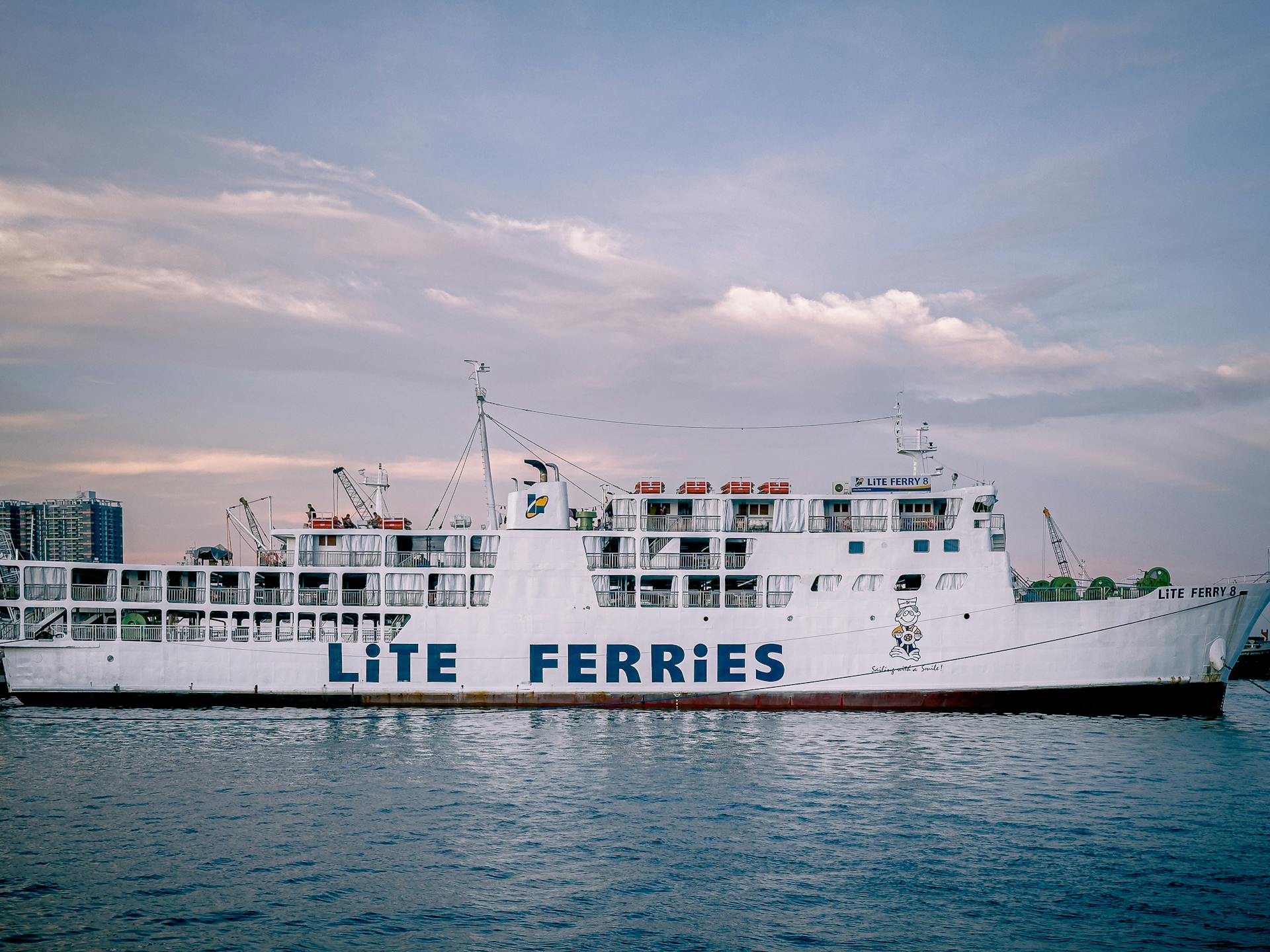 Large Lite Ferry ship docked in Cebu City, Philippines at dusk.