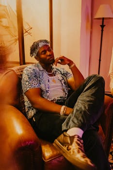 Chilled portrait of a man in a cozy Berlin living room setting at night.