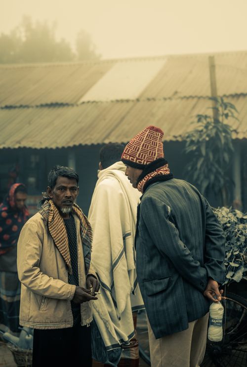 Free A candid moment of everyday life in a foggy morning street of Cumilla, Bangladesh. Stock Photo