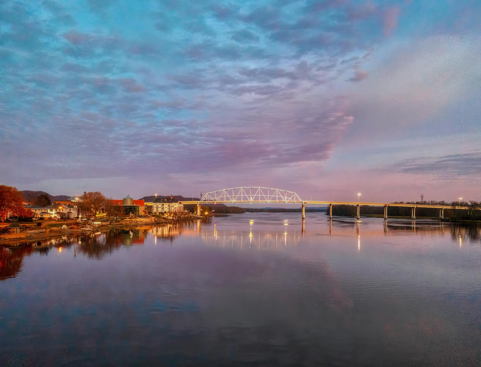 Scenic view of Wabasha, Minnesota with a calm Mississippi River at sunset.