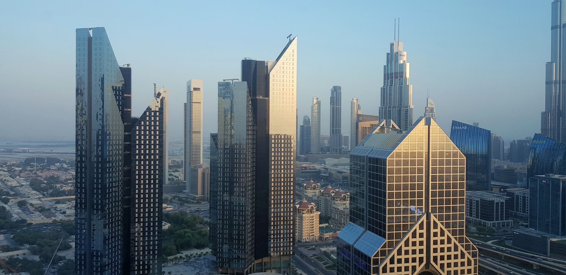 A stunning view of Dubai's modern skyline featuring iconic skyscrapers at day.