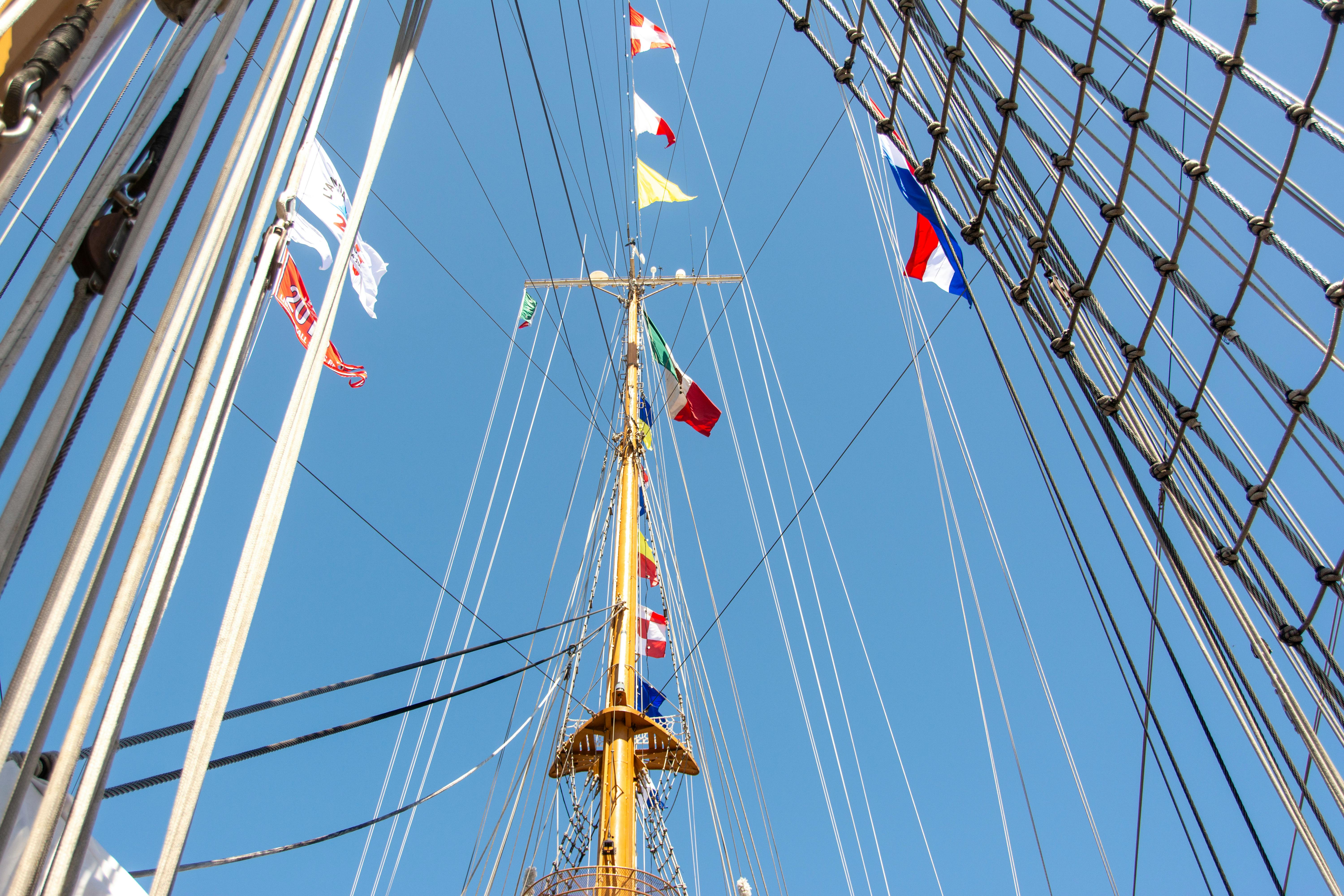 tall ship mast with colorful nautical flags