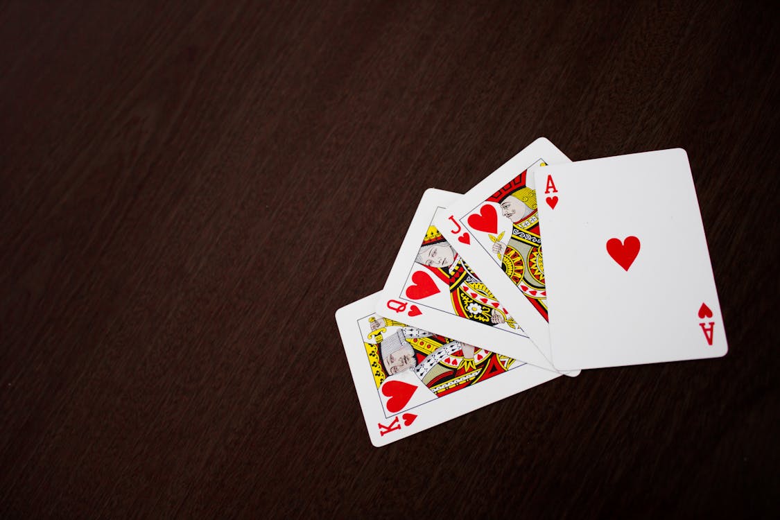 Free Ace, King, Jack, and King of Hearts Playing Cards Stock Photo