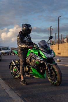 Biker on green and black Kawasaki motorcycle in Casablanca.