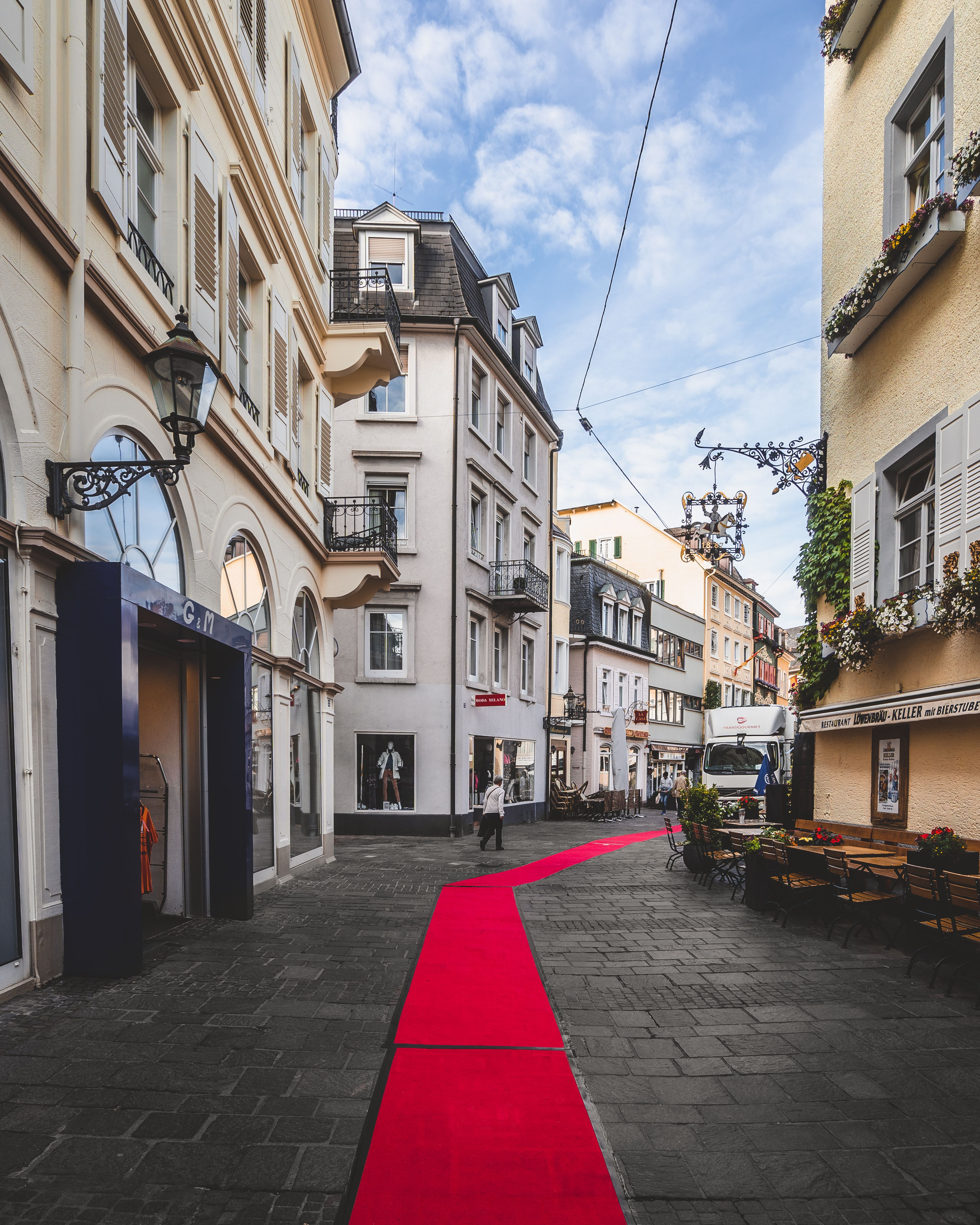Red Carpet In The Middle Of Road Between Buildings Free Stock Photo