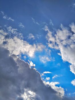 A captivating cloud formation set against a vivid azure sky, showcasing a dynamic weather scene.