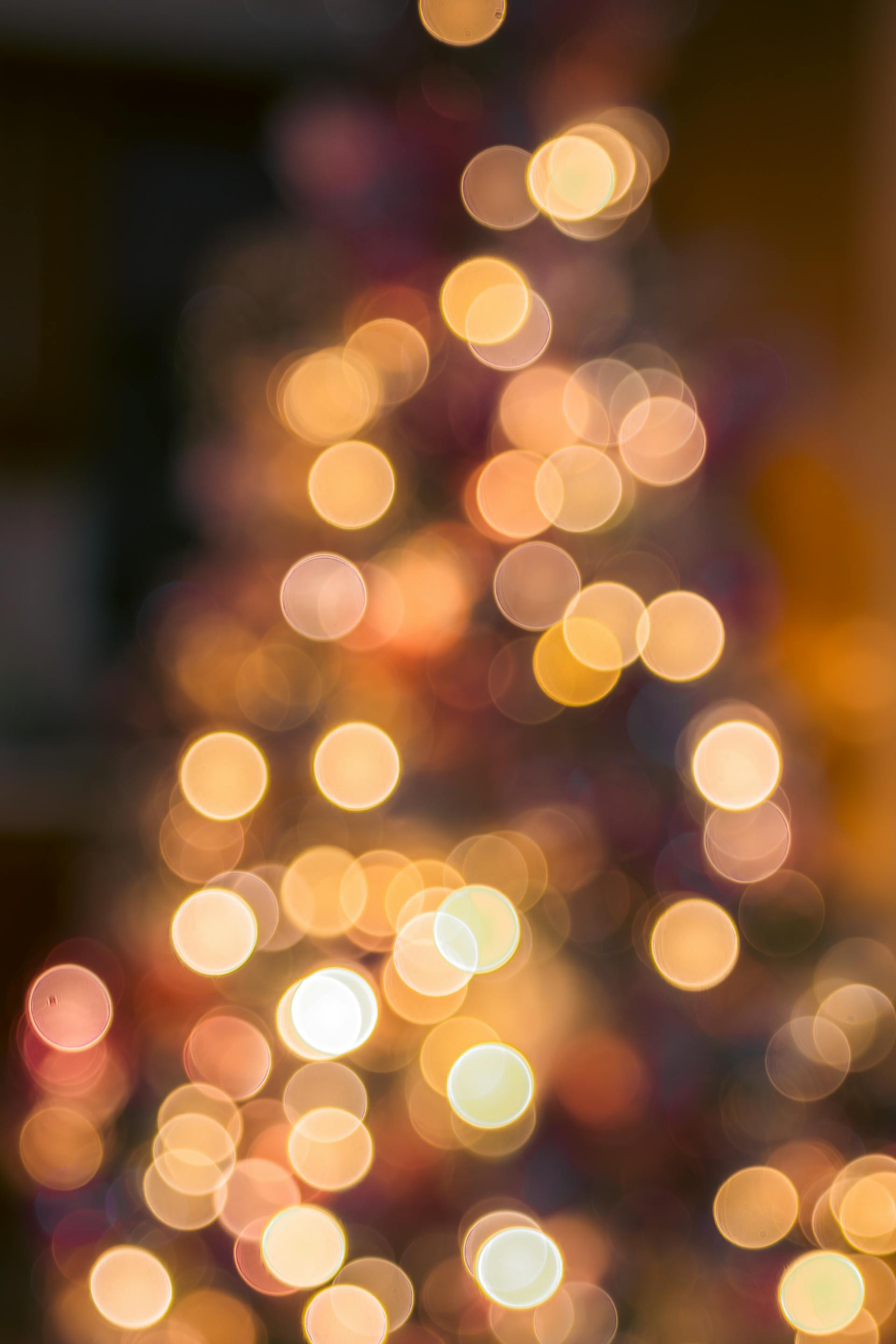 Festive bokeh lights creating a warm Christmas tree ambiance
