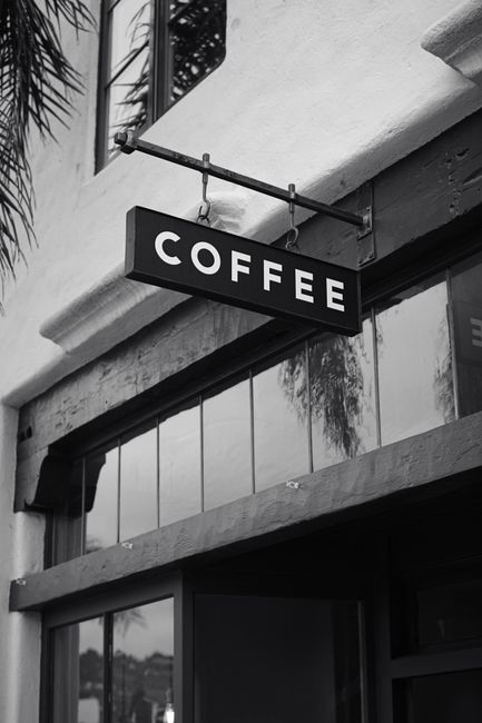 Monochrome image of a coffee sign outside a café in Santa Barbara, California.