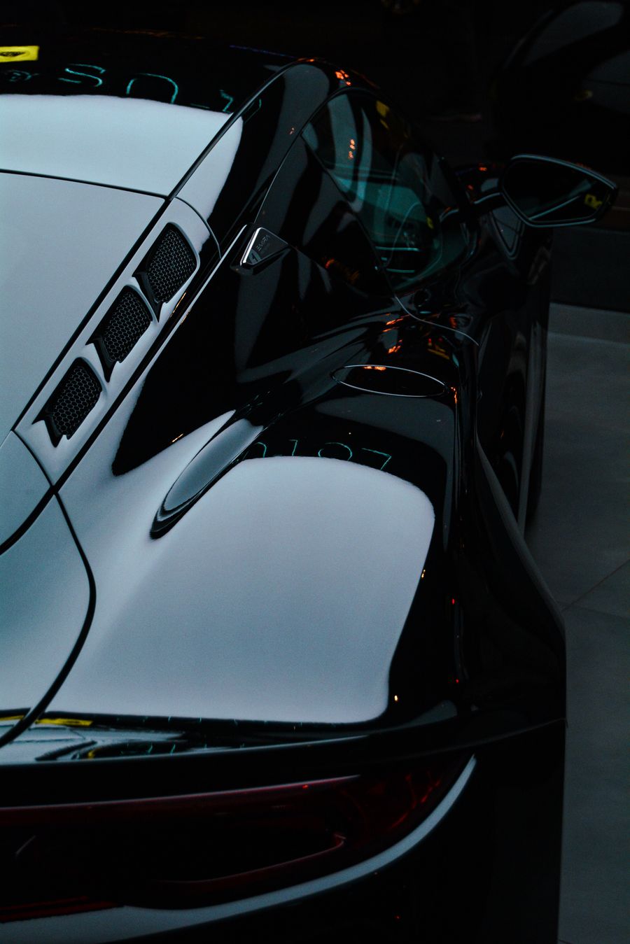 Glossy black sports car with ceramic coating finish