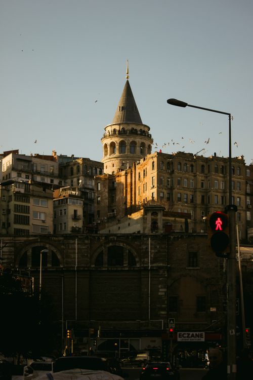 Free Scenic view of the historic Galata Tower in Istanbul at dusk with urban architecture. Stock Photo