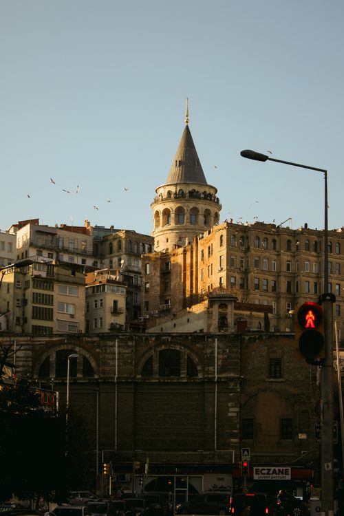 Free View of Galata Tower and surrounding buildings in Istanbul during twilight. Stock Photo