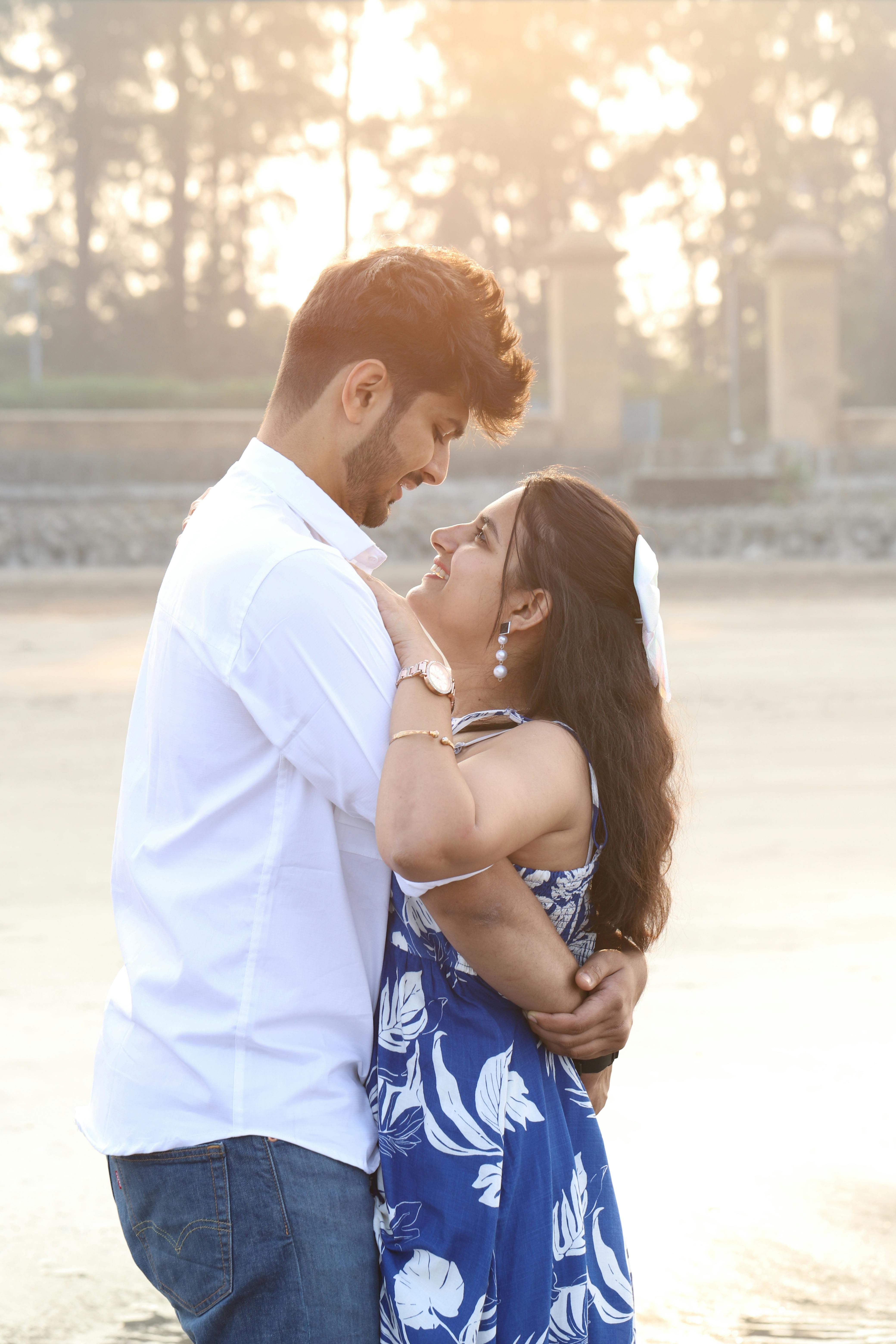 romantic couple embracing on sunny beach