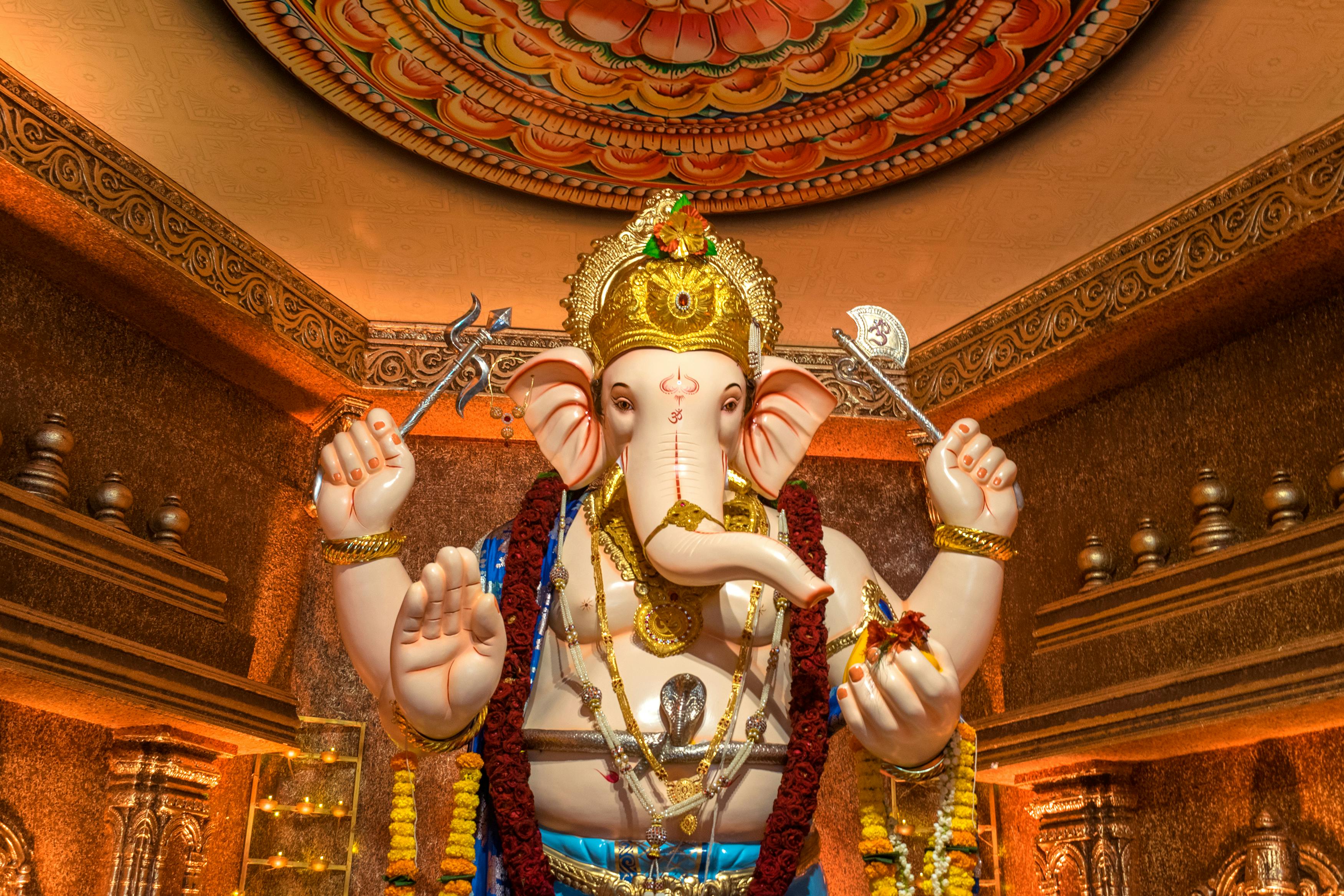 Decorative Ganesh idol in a Mumbai temple during Ganesh Chaturthi, showcasing vibrant cultural artistry. - Bombay