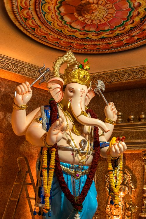 Free Colorful Ganesh statue adorned with flowers and ornaments during Ganesh Chaturthi festival in Mumbai, India. Stock Photo