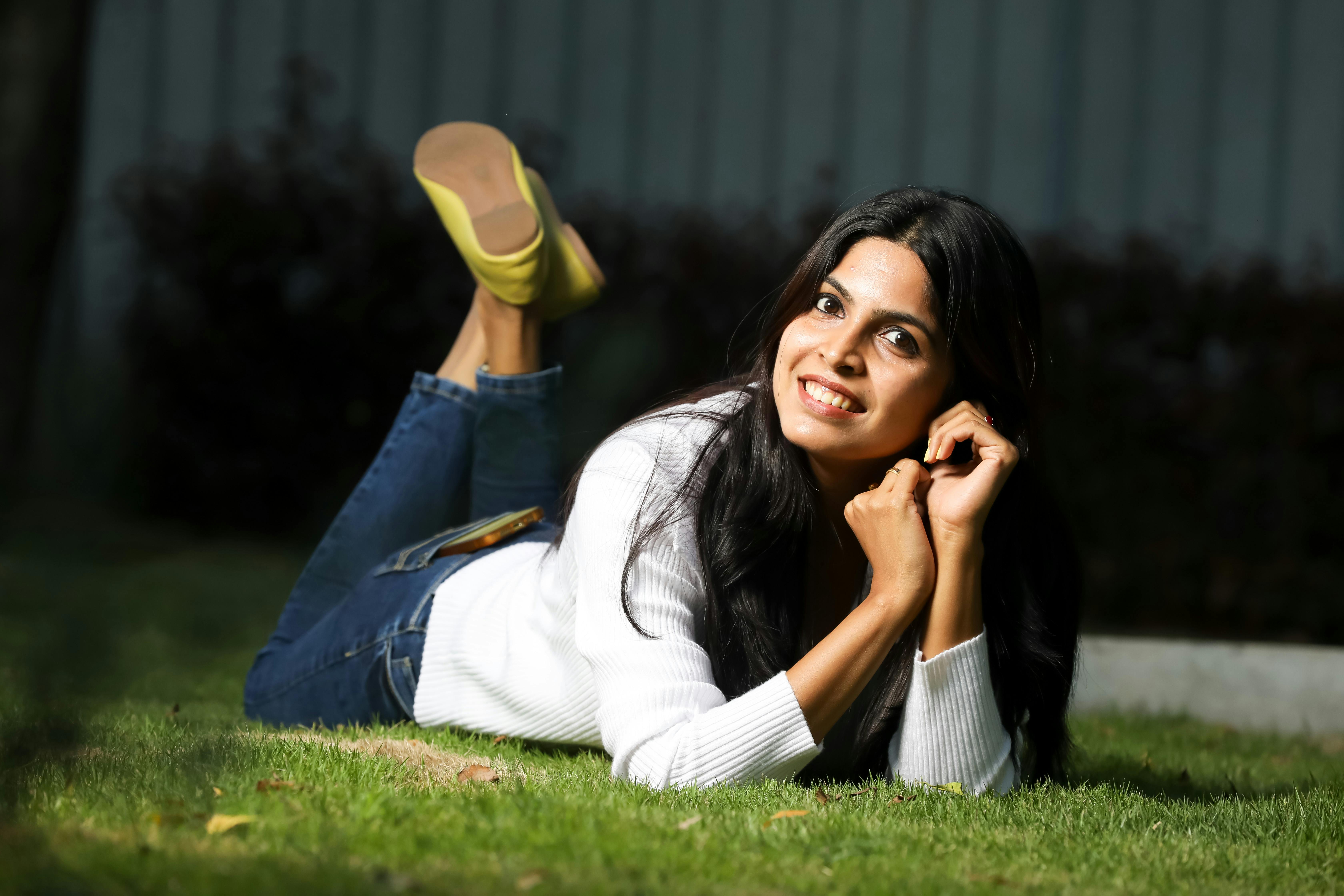 young woman relaxing on grass outdoors