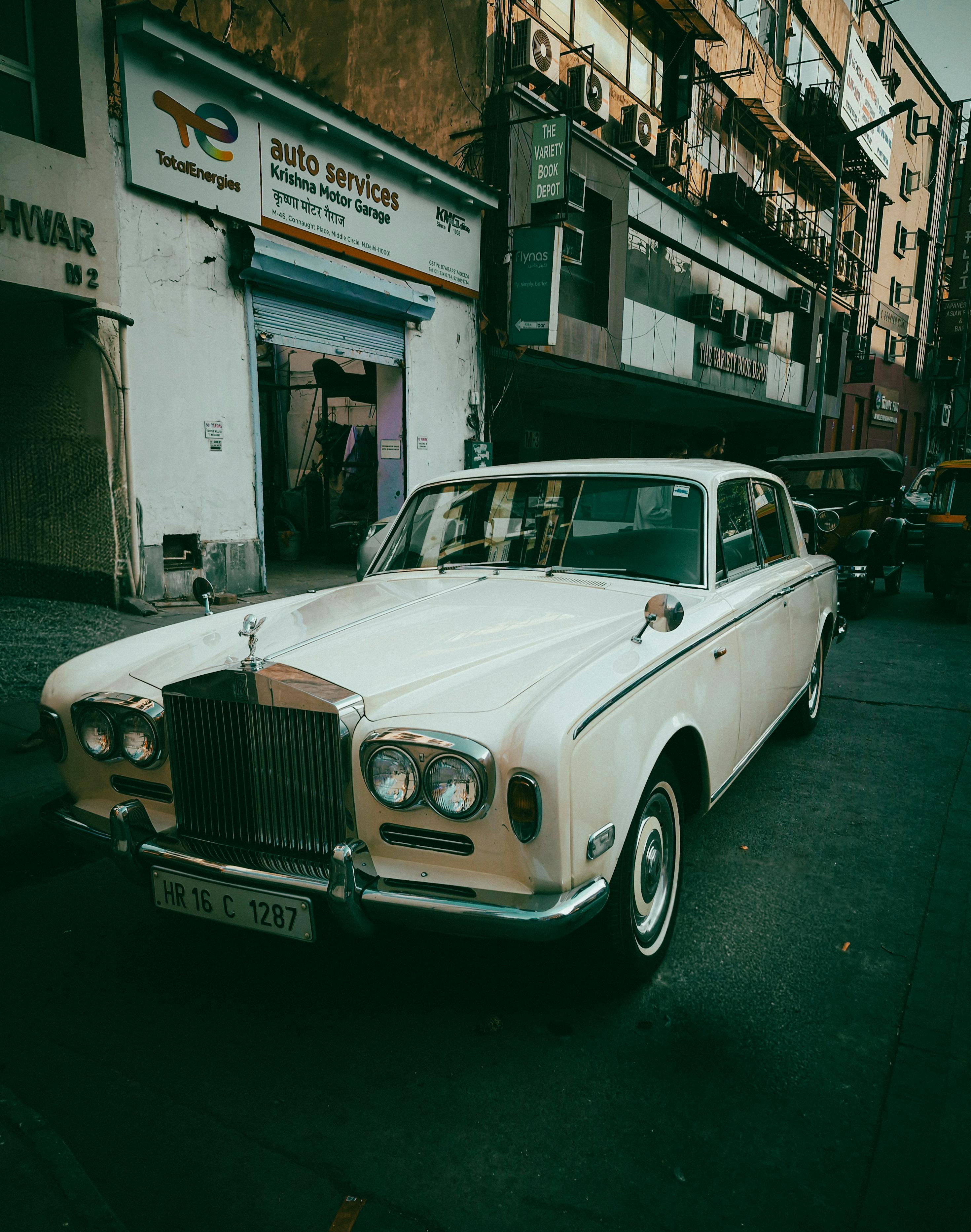 A vintage classic car parked on a bustling urban street, capturing a nostalgic feel.