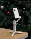 Smartphone on Gimbal Tripod in Festive Background