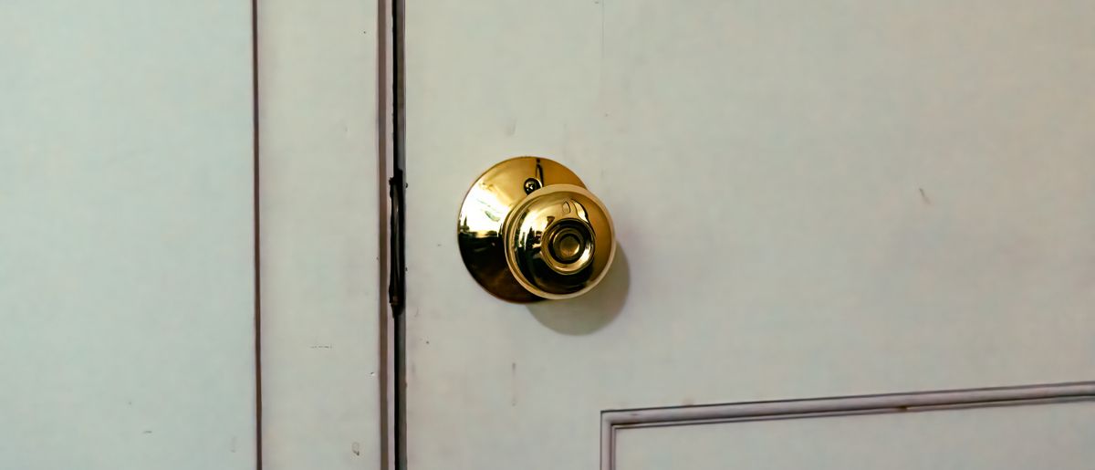 New door knob hardware installed on a door