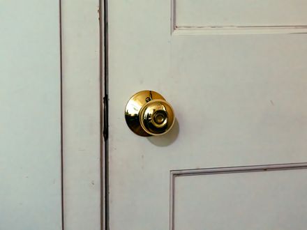 Door knob being installed on a door