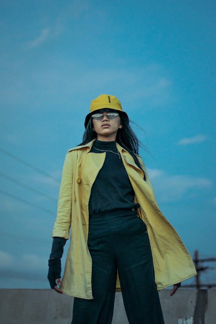 Woman Standing Outdoor Wearing Yellow Bucket Hat