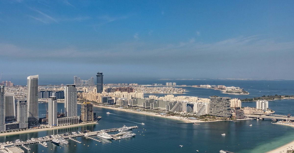 Stunning aerial view of Dubai Marina skyline and Palm Jumeirah on a clear day.