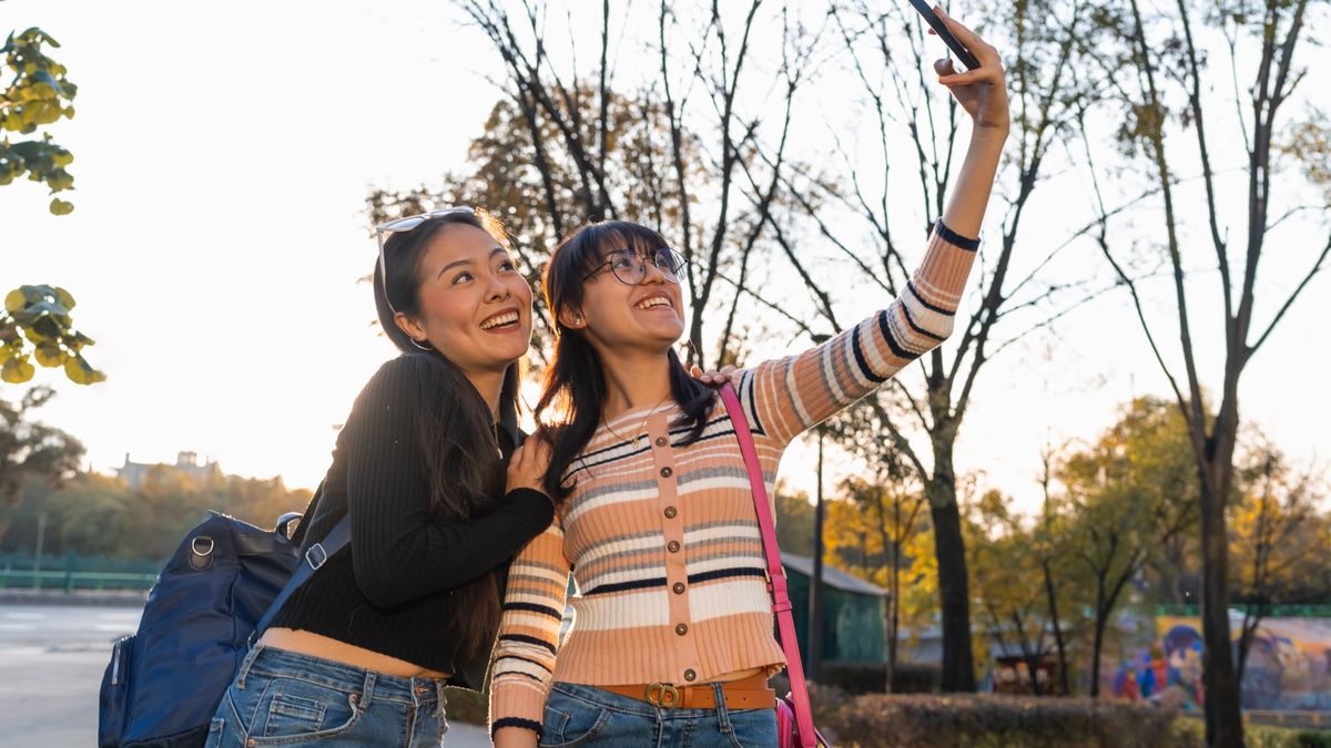 Colleagues capturing photos on a park scavenger hunt