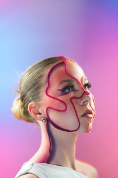 Creative portrait featuring abstract pink and blue face makeup