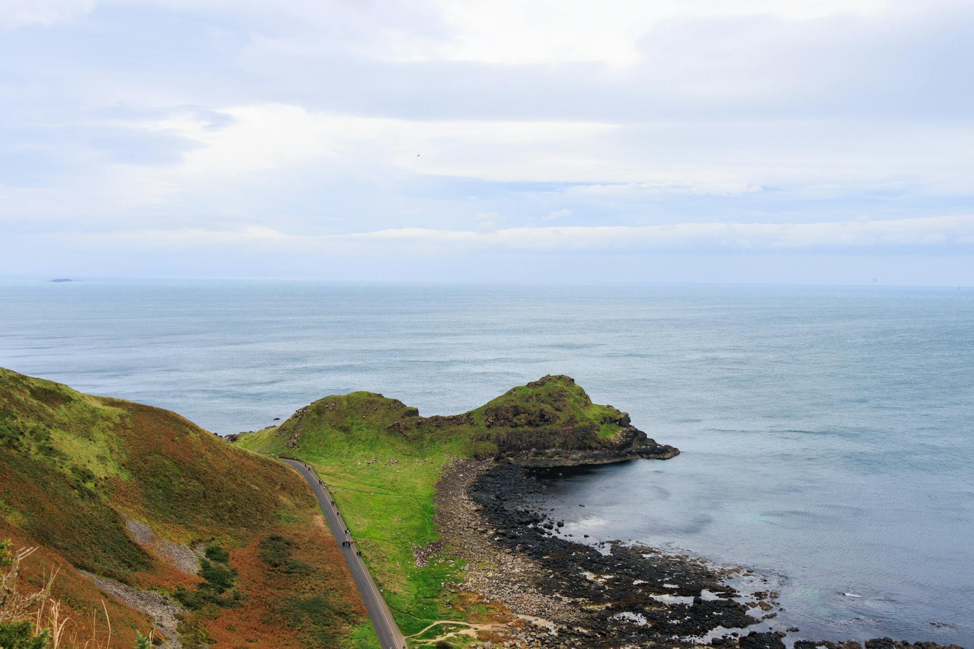 Stunning view of Northern Ireland's rugged coastline and sea from a high vantage point.