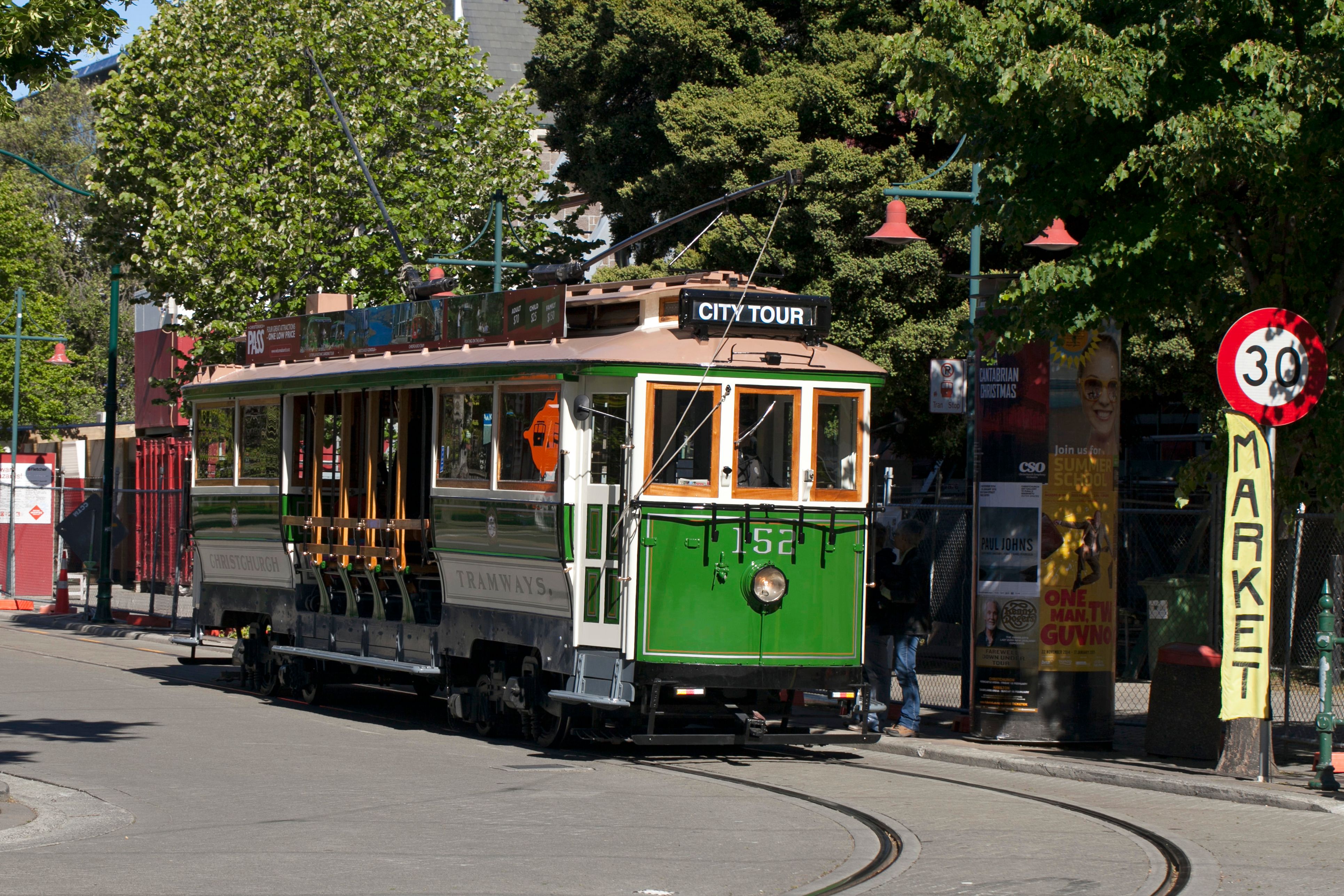 Historic Green Tram on City Street Tour Route · Free Stock Photo