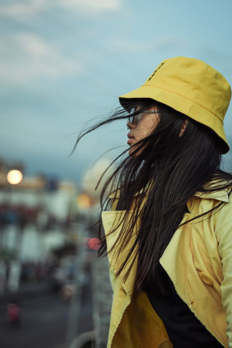 Woman Wearing Yellow Jacket And Yellow Bucket Hat