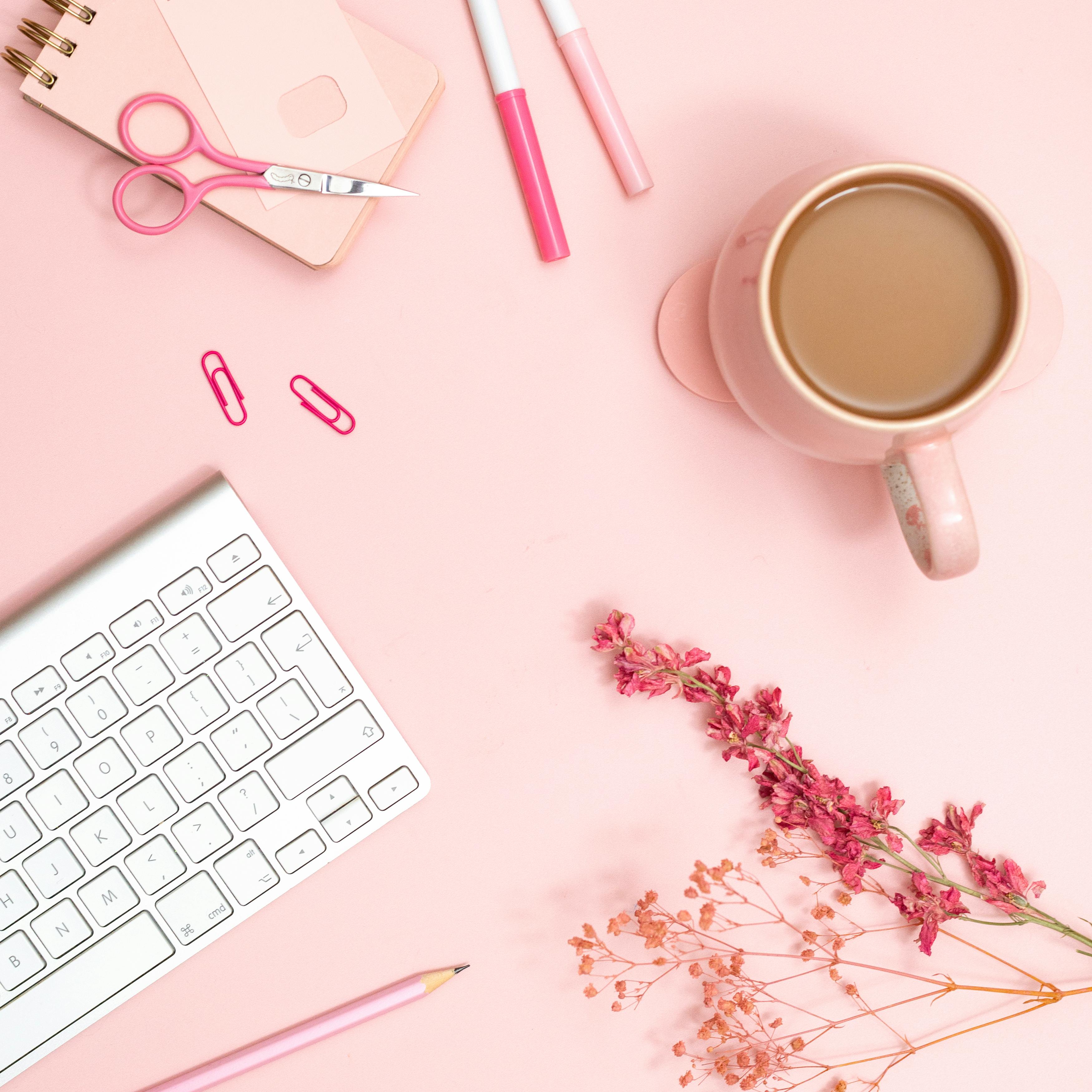 stylish pink office desk flat lay with stationery