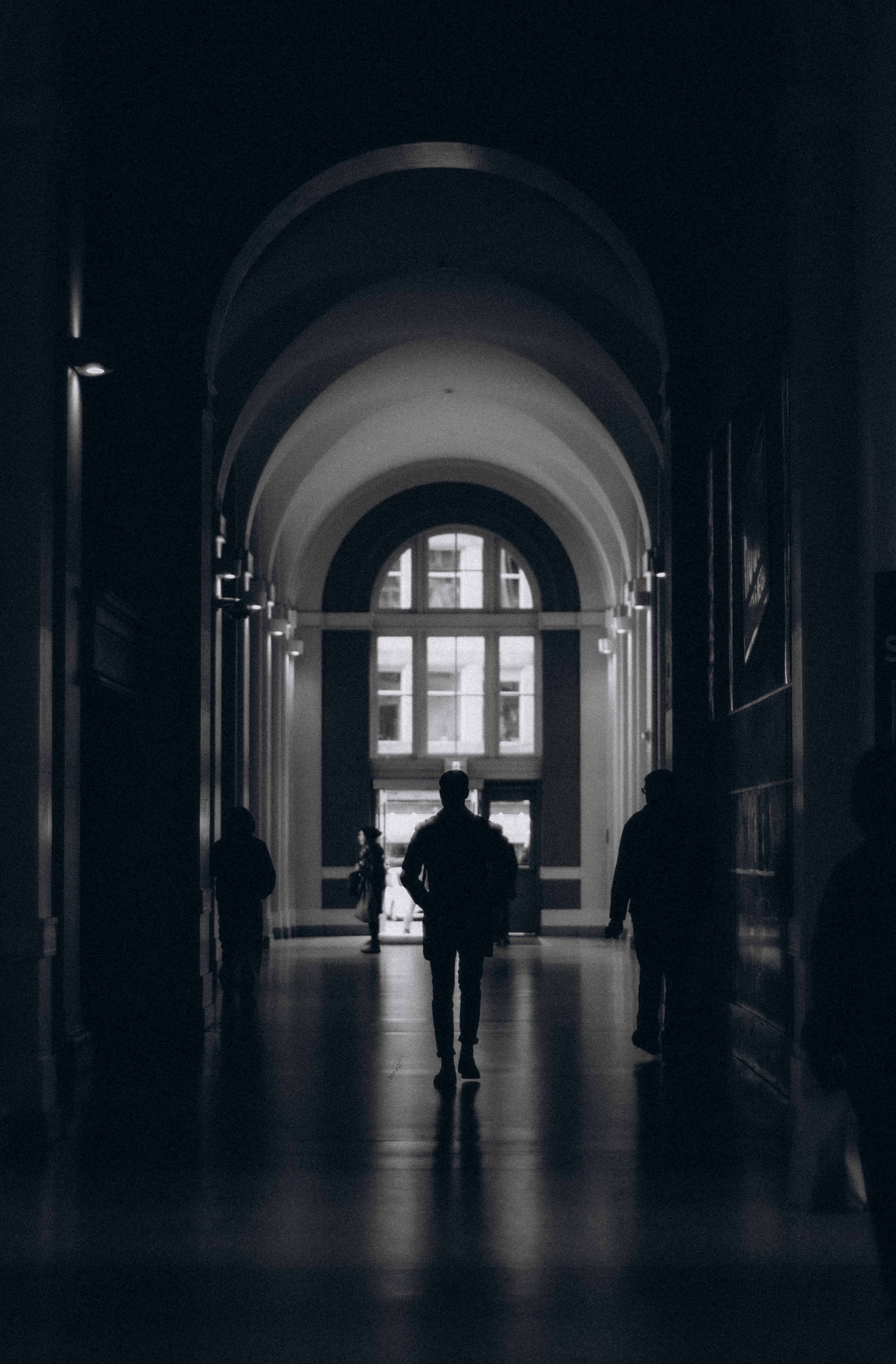 Silhouette of a Person Standing in front of a Window · Free Stock Photo
